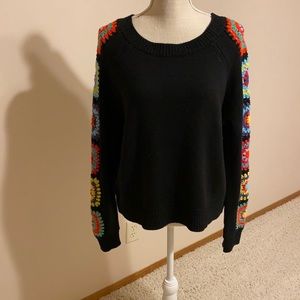 Boho sweater with crochet details down the sleeves